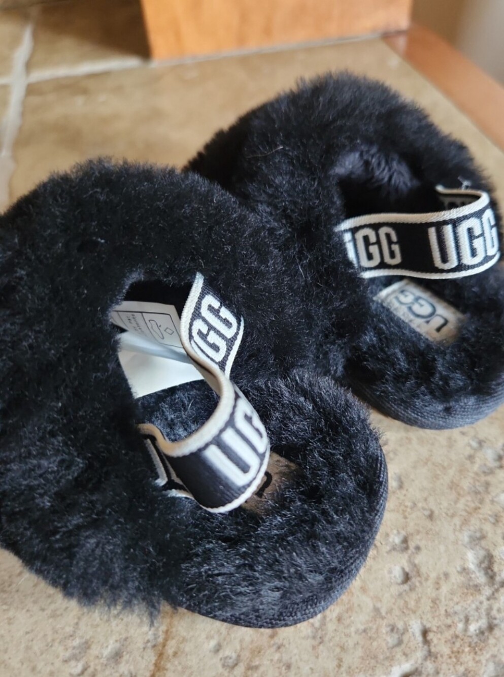 UGG Baby Black Fuzzy Slide Sandals with Logo Heel Strap
